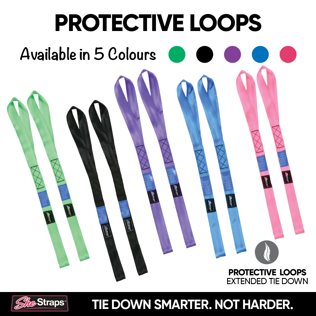 A promotional graphic for SheStraps Protective Loops showing five pairs of webbing straps in different colors: light green, black, purple, blue, and pink. Above the product, text reads 'PROTECTIVE LOOPS' and 'Available in 5 Colours' with matching color circles.